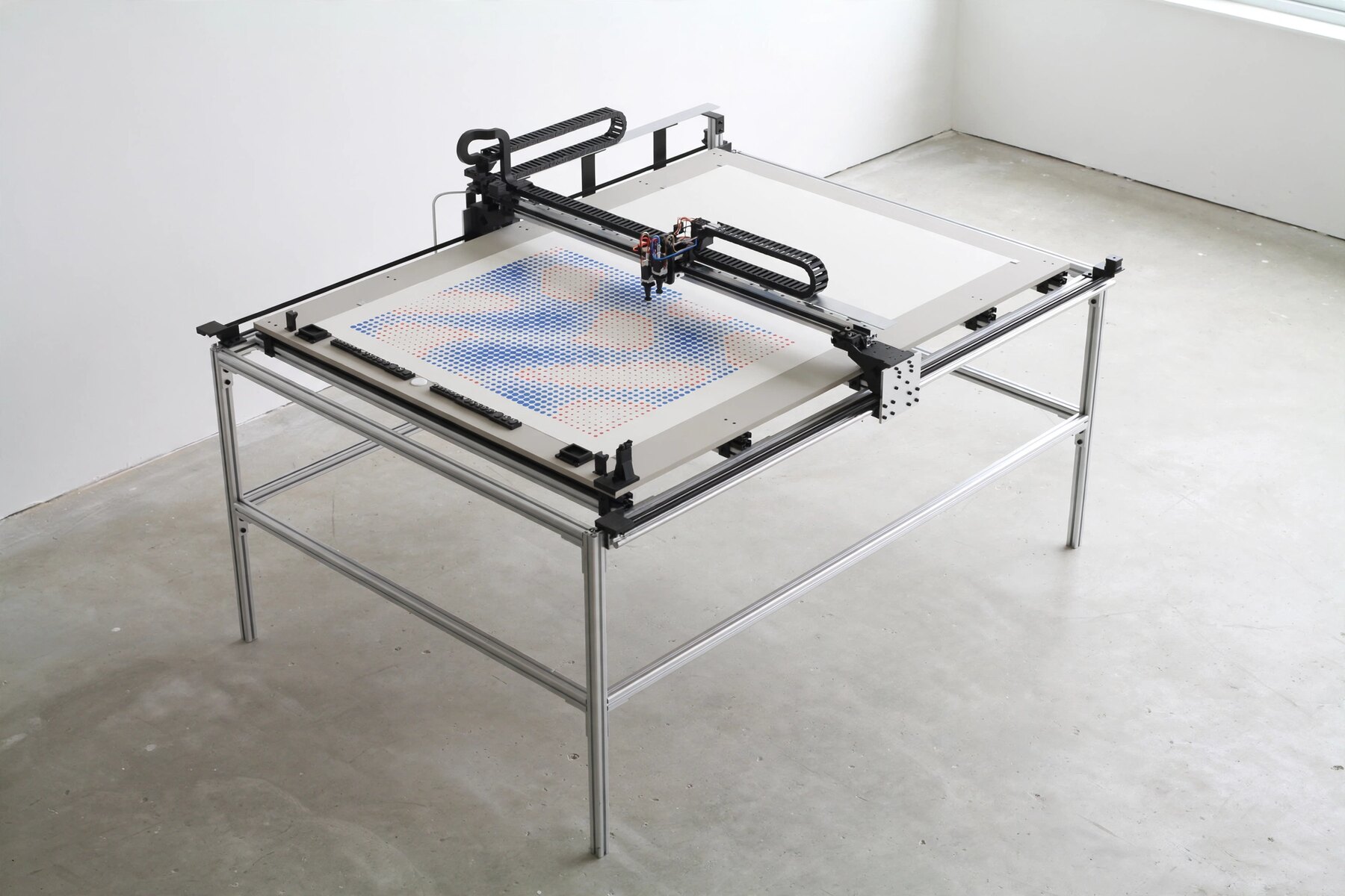 The whole machine in a studio, part way through a sheet of sponge marks